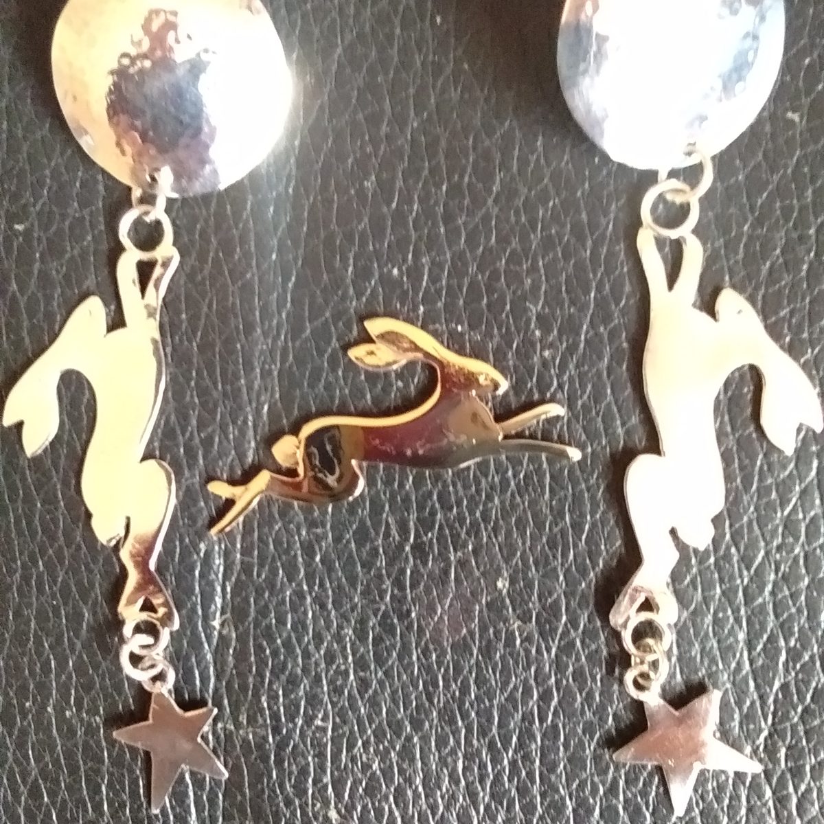 Silver hare and star drop earrings with hammered discs